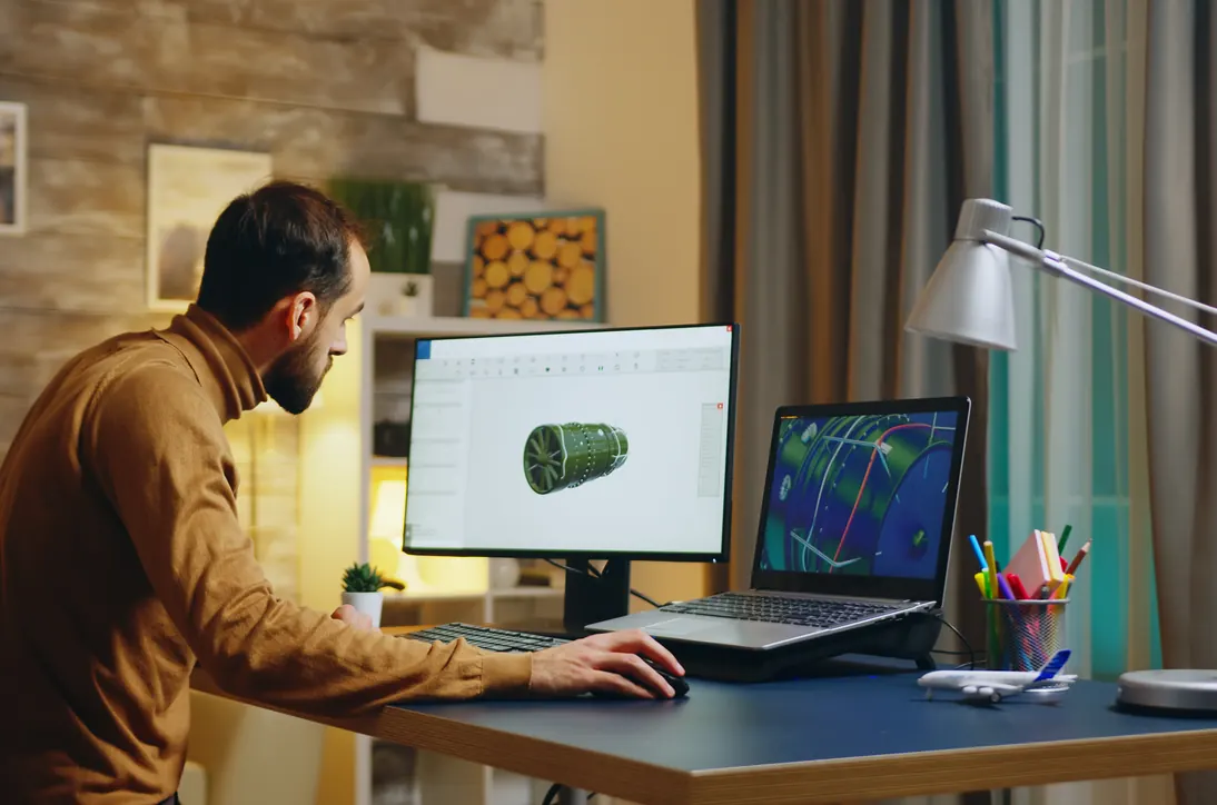 Product engineer working on a 3D mechanical design at a workstation